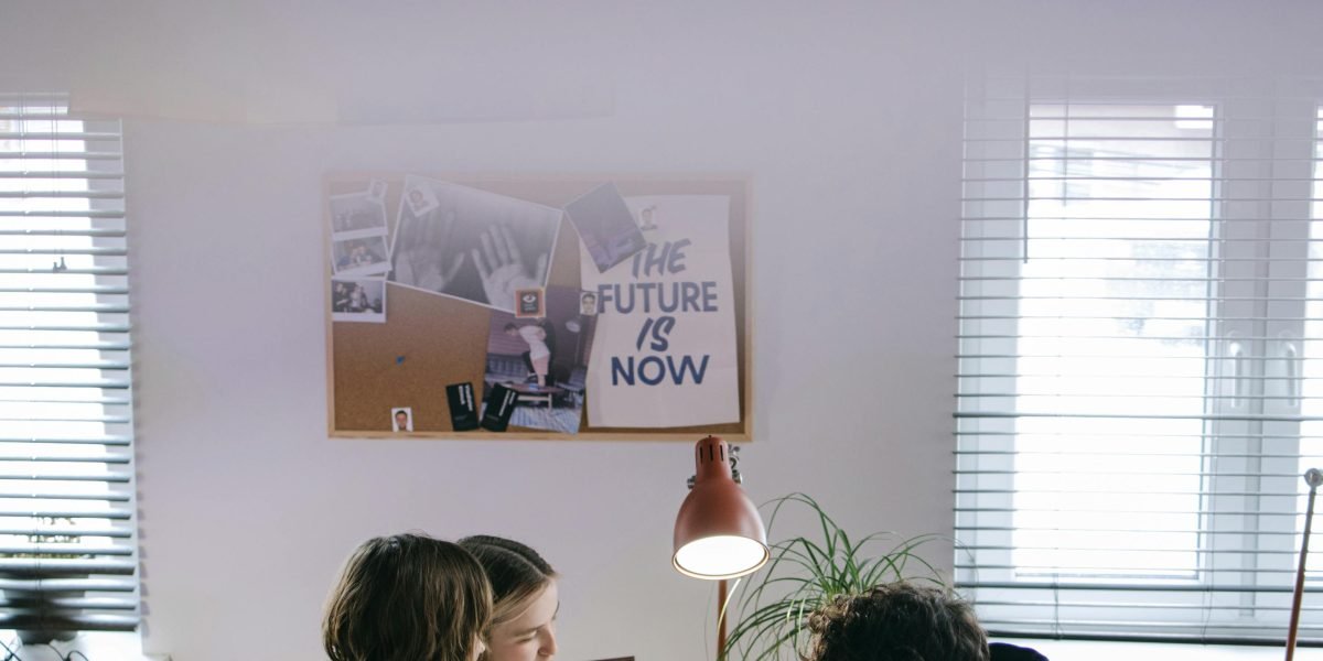 A team of professionals collaborating in a modern office, discussing optimization strategies for media campaigns.