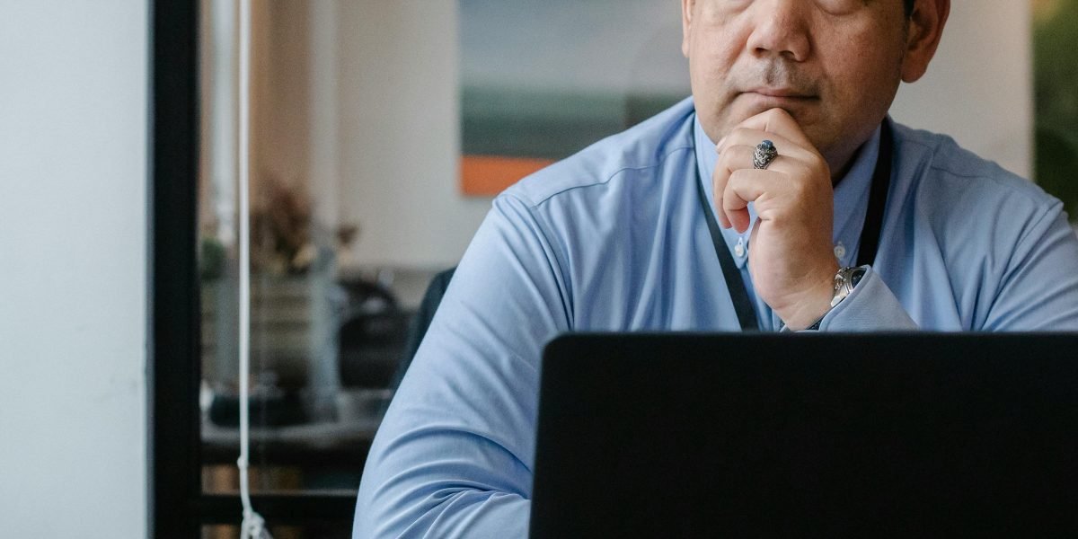 A media executive deeply engrossed in thought, considering strategies to adapt to the rapidly changing industry landscape.