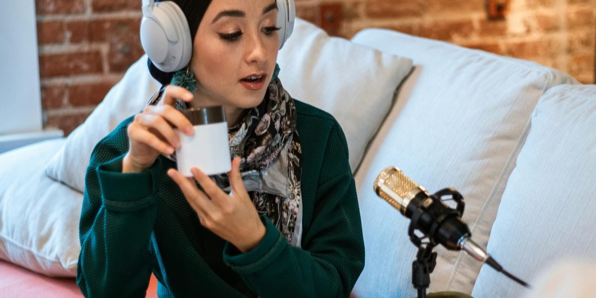 A person listening intently to a podcast through headphones, illustrating the engagement driven by audio content.