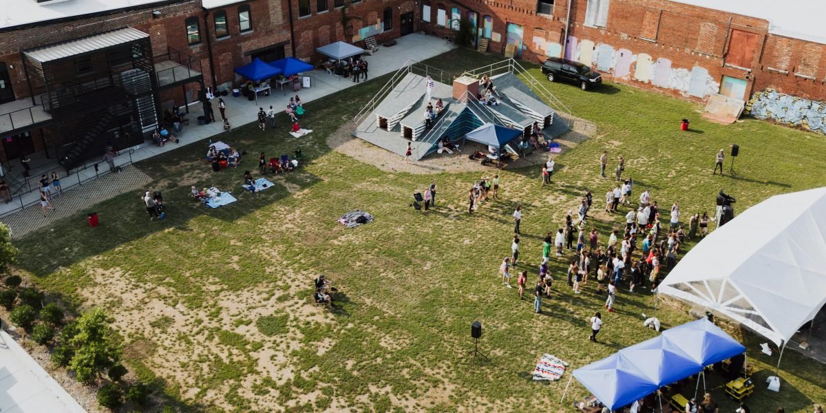 A vibrant community gathering in a local setting, symbolizing the resurgence of trusted local media and connections.