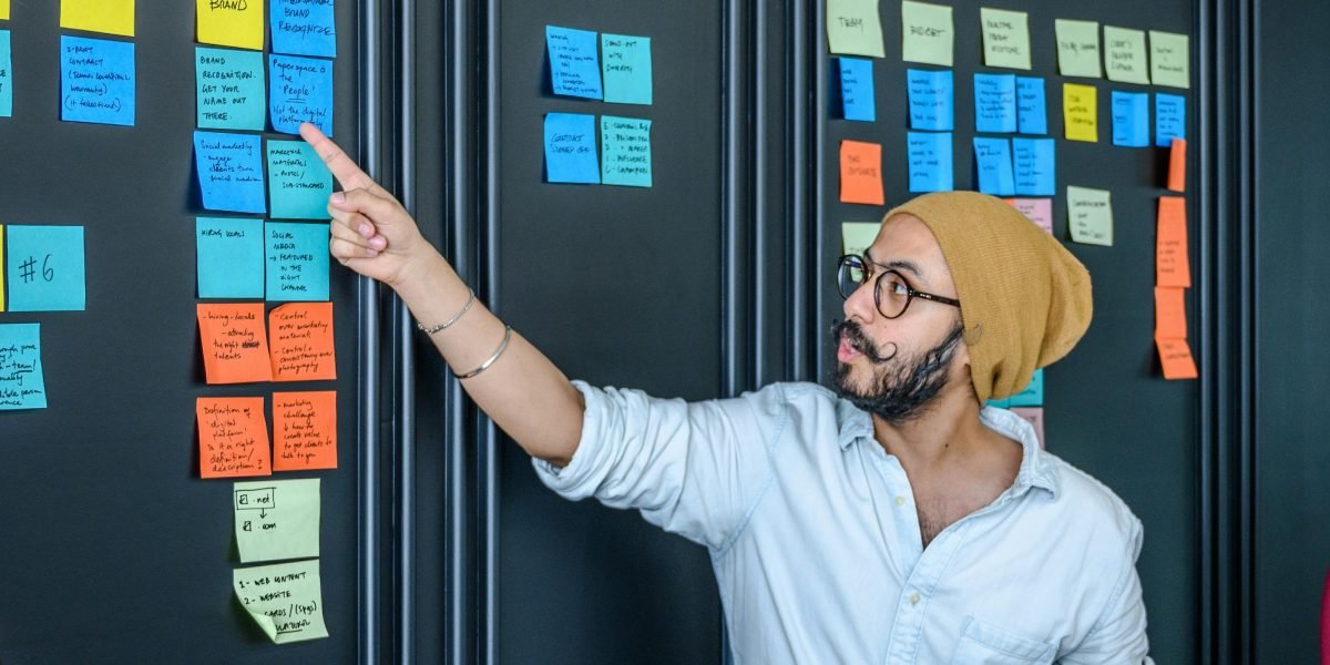 Colleagues actively brainstorm and discuss innovative concepts, preparing for future trends in celebrity and creator partnerships.