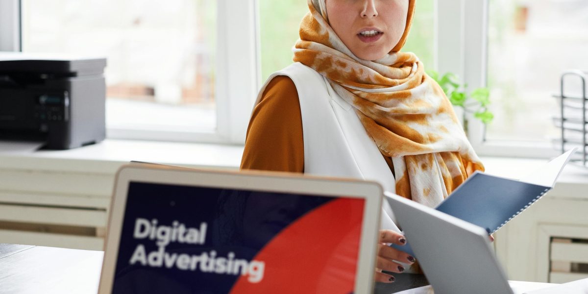 A team collaborates in a modern office setting, planning a comprehensive advertising strategy that integrates with business goals.