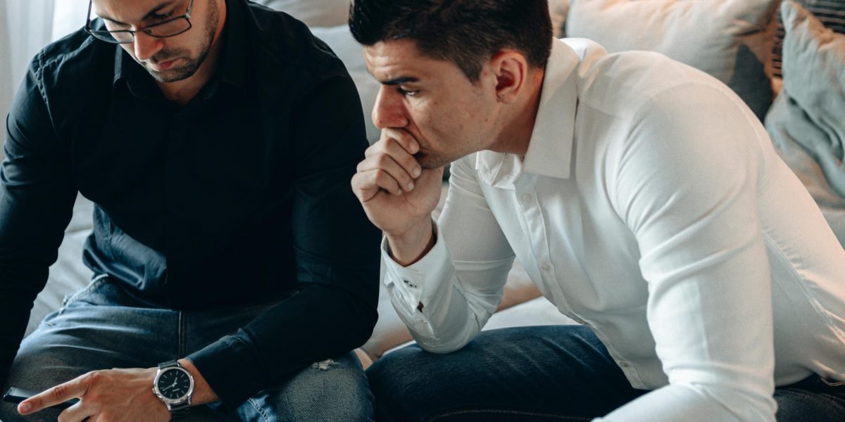 Marketing professionals analyze performance metrics on a dashboard, identifying where budget is best spent across customer journey stages.