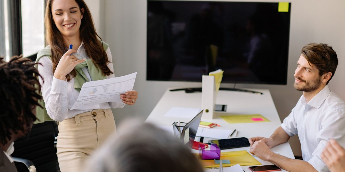 A professional presenting ideas confidently, symbolizing the effort to capture qualified interest in lead generation.