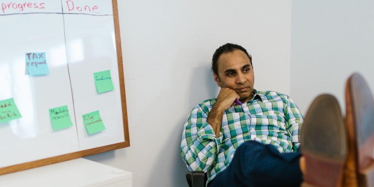 A person thoughtfully evaluates and prioritizes key features for a new marketing platform.