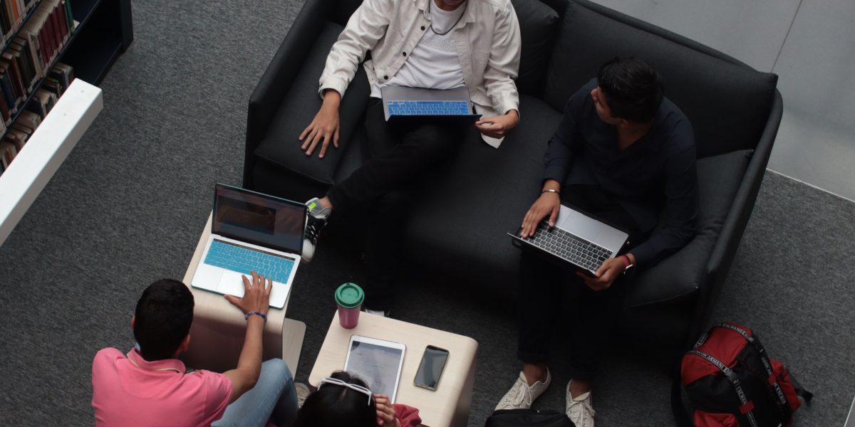 A diverse team engages in a collaborative learning session, fostering continuous professional development.