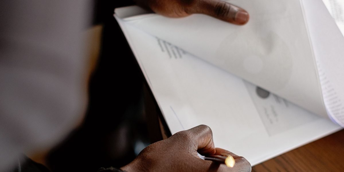 A professional analyzing charts and reports, reflecting the focus on metrics in performance marketing.