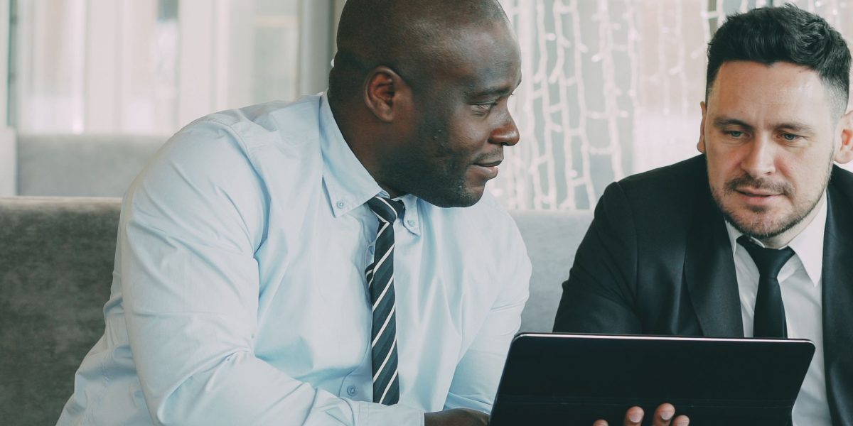 Business leaders engaged in a focused discussion, making strategic decisions for their organization's future in a dynamic market.
