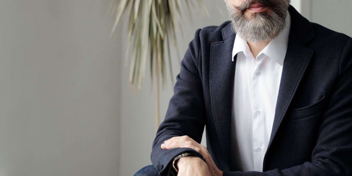 A business leader looking confident and determined, symbolizing smart financial planning and effective resource allocation in advertising.