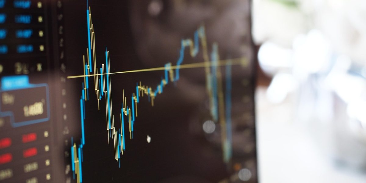 A business professional meticulously analyzing data charts and reports to understand campaign performance and impact.