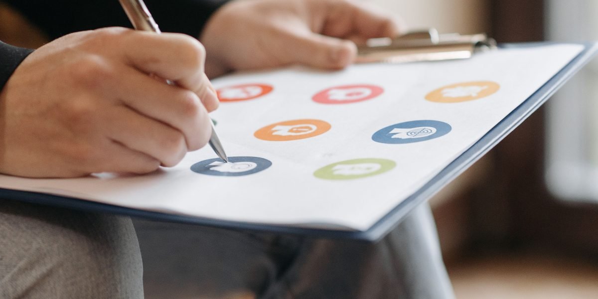 A person organizing various elements on a large whiteboard, symbolizing the effort to bring clarity to fragmented digital marketing strategies.
