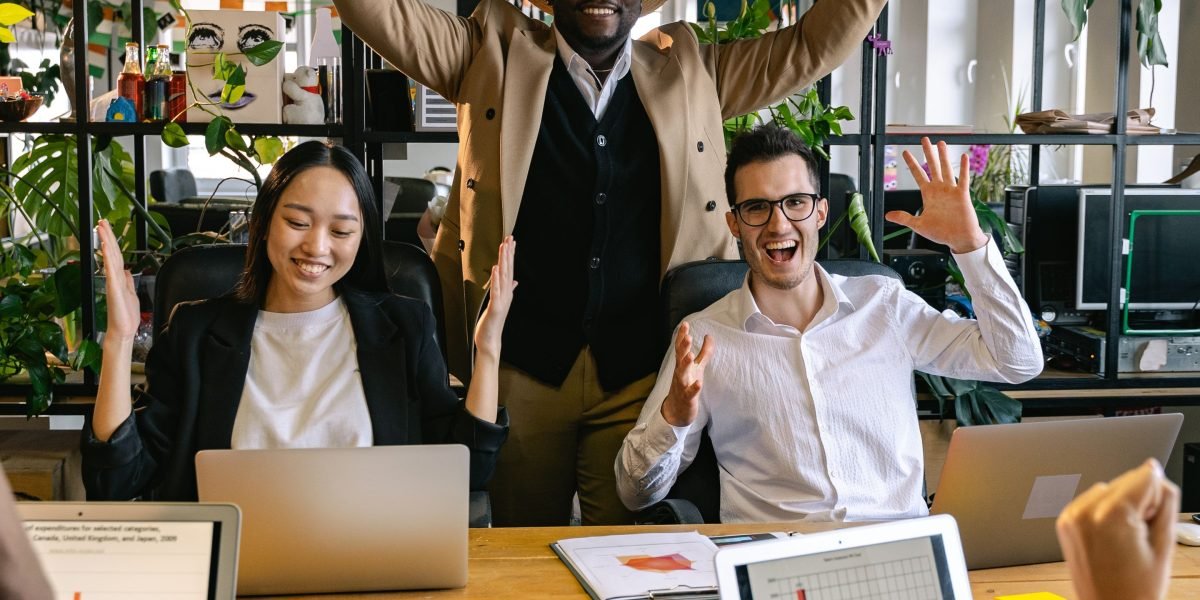 A diverse team celebrating a successful collaboration, symbolizing mutually beneficial partnerships in affiliate marketing.