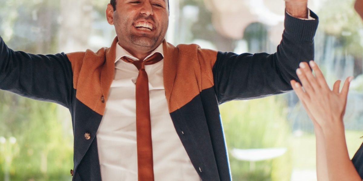 A group of diverse individuals showing positive reactions, illustrating the power of emotional resonance in advertising.