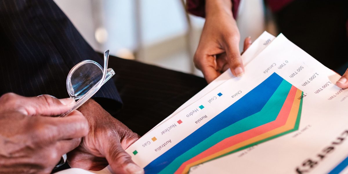 A professional team collaboratively analyzing performance data, symbolizing the crucial role of measurement in advertising effectiveness.