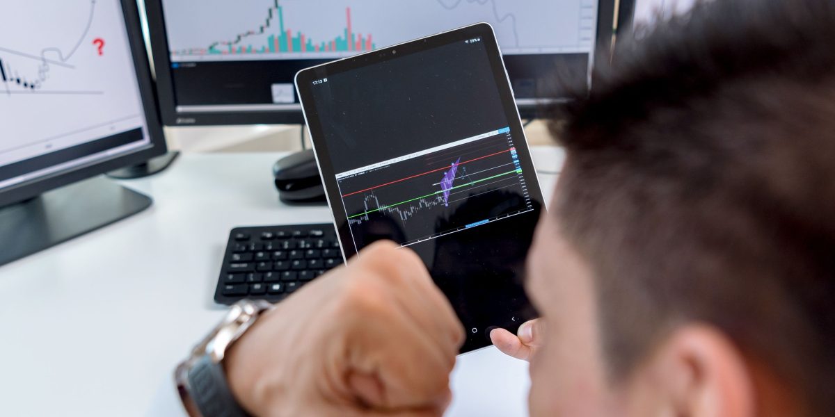A person confidently analyzing data on a screen, representing the process of identifying high-value accounts.