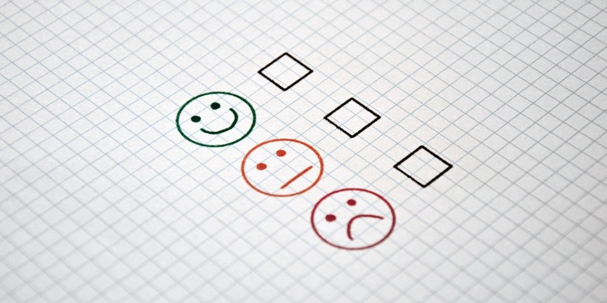An individual diligently working through a checklist to thoroughly evaluate a sales recruitment opportunity.