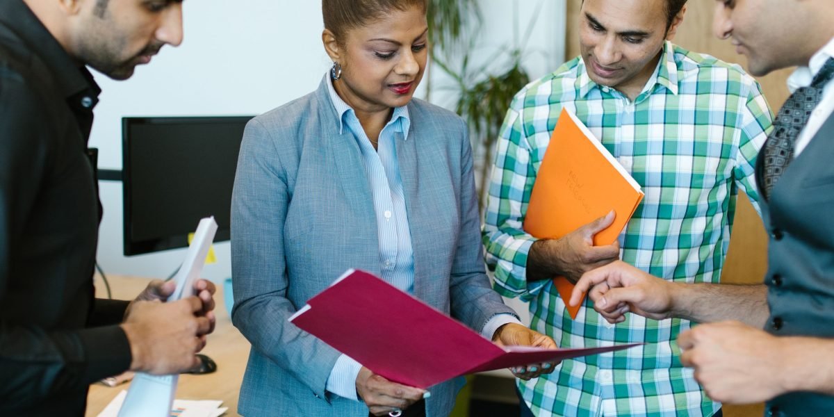 A team of professionals in a meeting, actively discussing new privacy regulations and their impact on advertising.