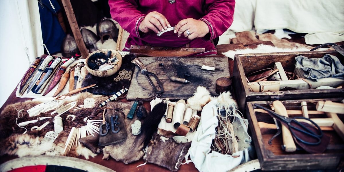A person intently writing or sketching, representing the creative process of developing a powerful and shareable story.