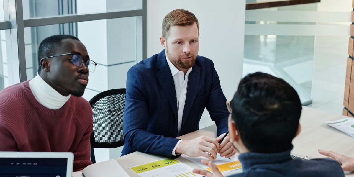 A business owner and agency representative discussing marketing strategies face-to-face.