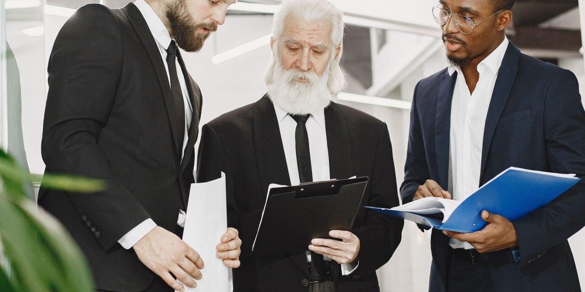 Business leaders in a focused meeting, symbolizing the strategic importance of digital marketing software.