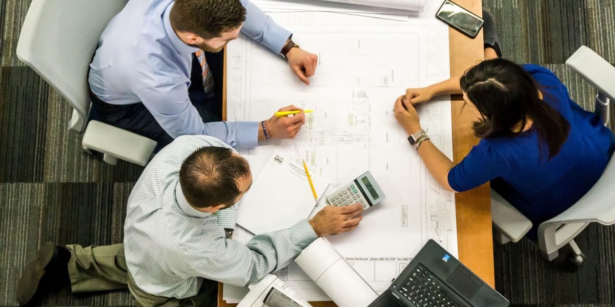 A professional confidently presents project insights to an audience, establishing authority and leadership.