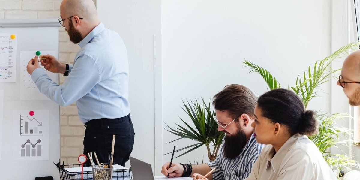 A team reviewing data and charts to evaluate monetization strategies and identify opportunities for sustainable growth through experimentation.