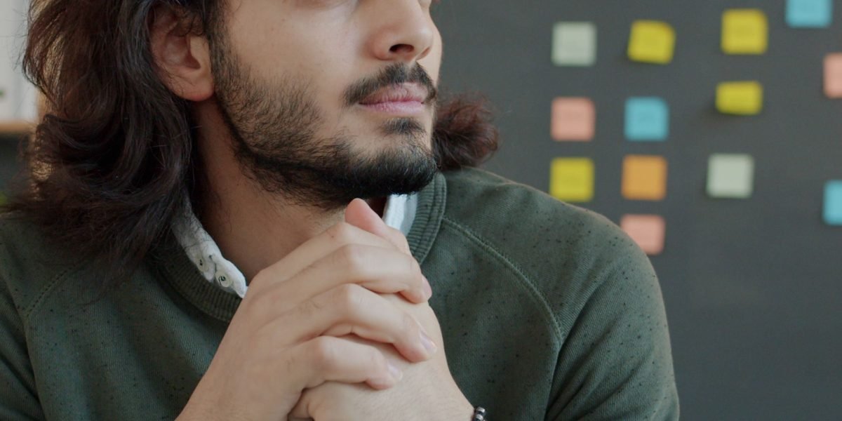 A business professional deeply contemplating future marketing strategies in a rapidly changing digital landscape.