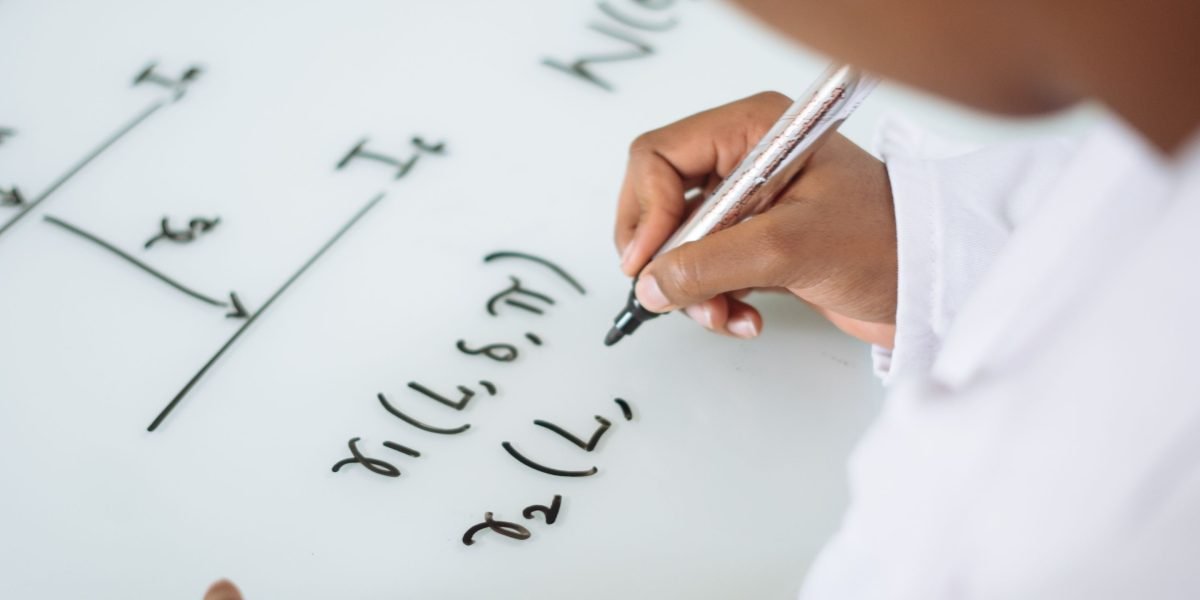 A person attentively browsing online, seeking marketing solutions for their business.